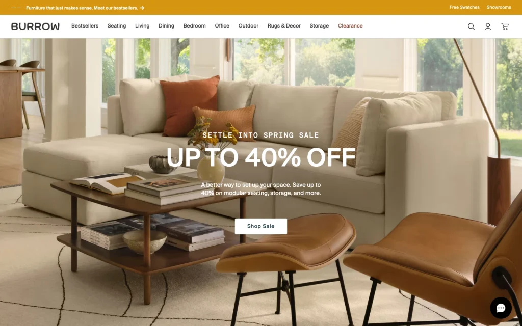 Burrow homepage screenshot — 'Settle into Spring Sale Up to 40% Off' modular sofa lifestyle hero with leather lounge chair.